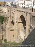 People crossing Ronda's New Bridge
